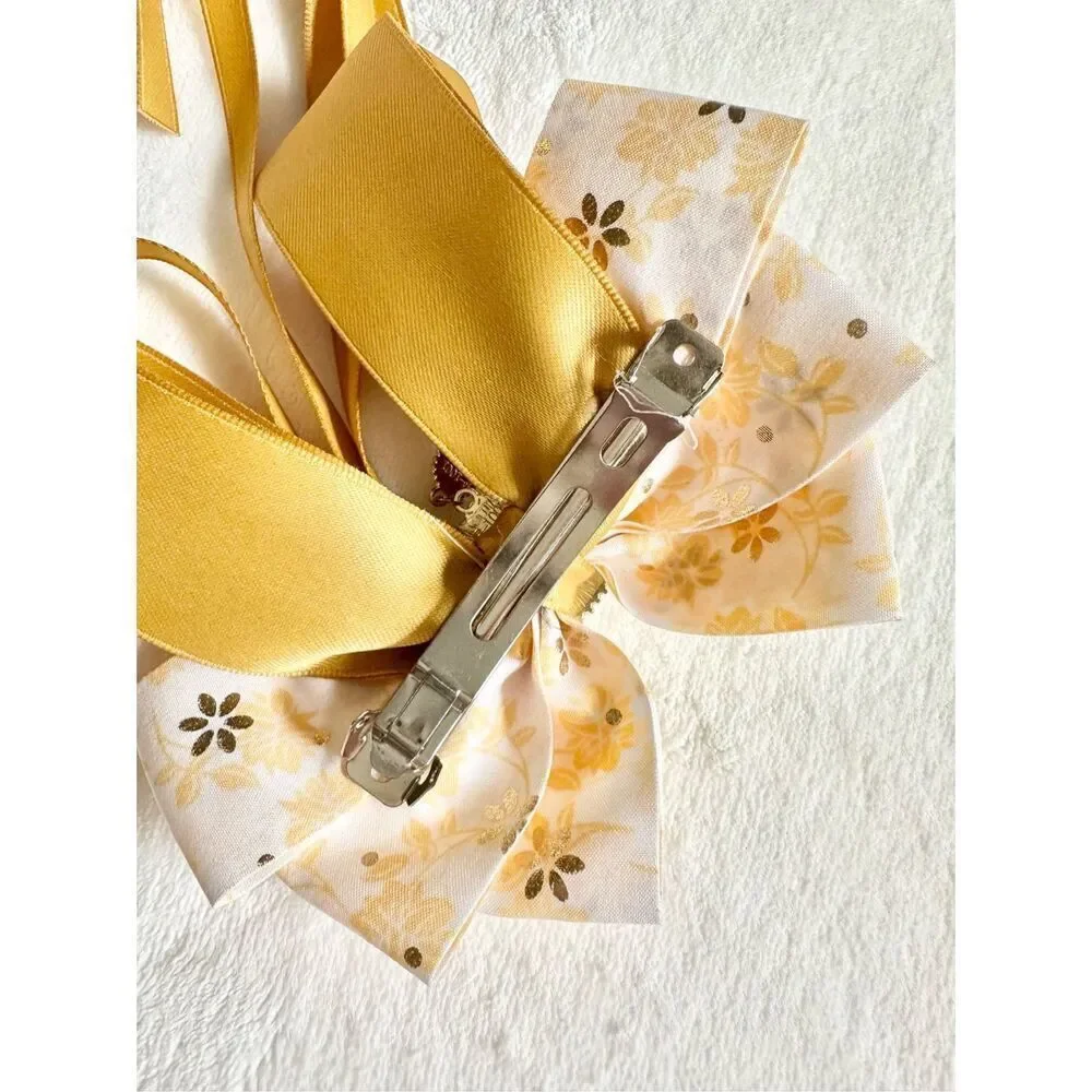 Adorable floral yellow hair bow with floral and pearl accents with hair Barrette